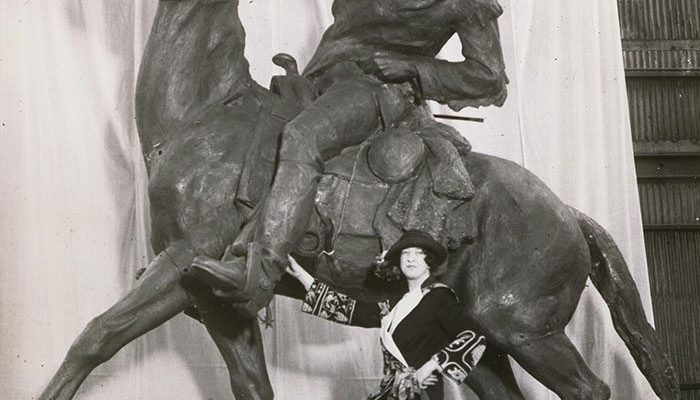 Gertrude Vanderbilt Whitney poses with Buffalo Bill—The Scout, her 1924 sculpture of William F. Cody. MS6 William F. Cody Collection. P.69.517