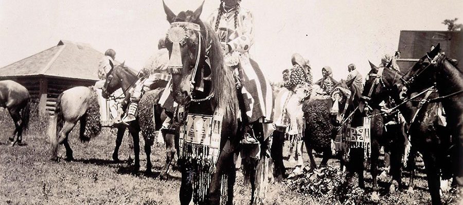 Absaroke (Crow) woman on horse at Crow Fair, Crow Agency, Montana. Photo by W.H.D. Koerner, 1927. P.78.4477