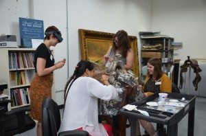 Conservation interns spit cleaning the California Mission saddle.