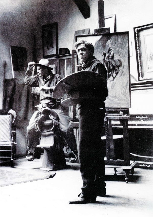 N.C. Wyeth in his studio as he paints "Rounding Up," with Allen Tupper True on the saddle posing for the painting. Photographer unknown, ca. 1905. Allen Tupper True Papers, Archives of American Art, Smithsonian Institution, Washington, D.C.