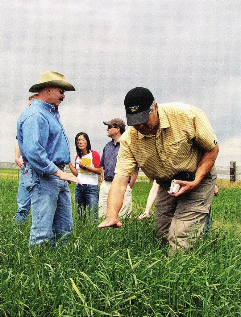 Charles Preston (left), Draper Natural History Museum Curator, leads a filed trip of visiting scholars to explore the grassbanks at the Heart Mountain Ranch near Cody.