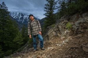 Joe Riis triggers his motion-activated “camera-trap” to test lighting.