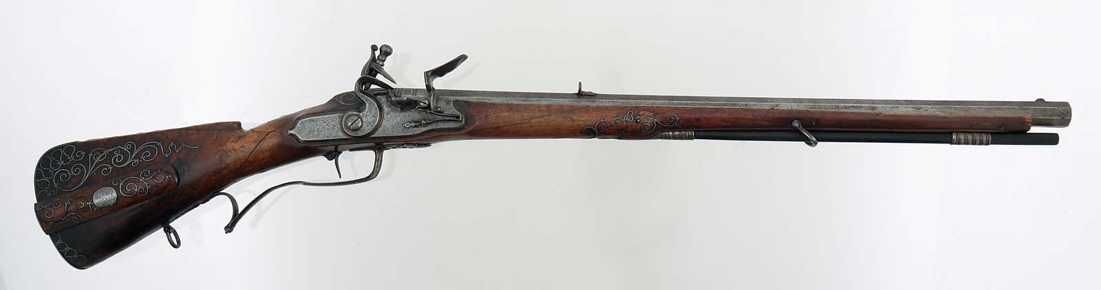 Click the image to view this example of a flintlock system closer. This is a German Flintlock Rifle with an octagon barrel. Gift of Olin Corporation, Winchester Arms Collection. 1988.8.391