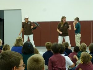 Peregrine falcon and student during eating contest.