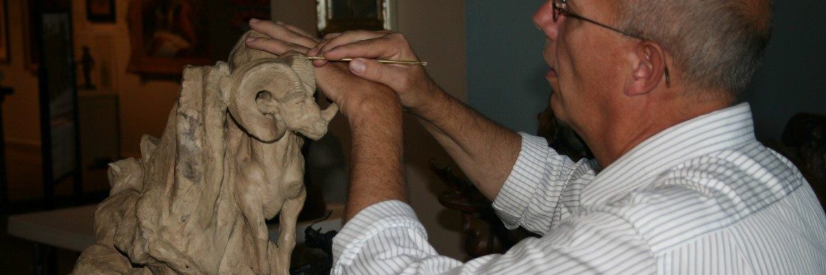 Jeff Rudolph sculpting with clay.