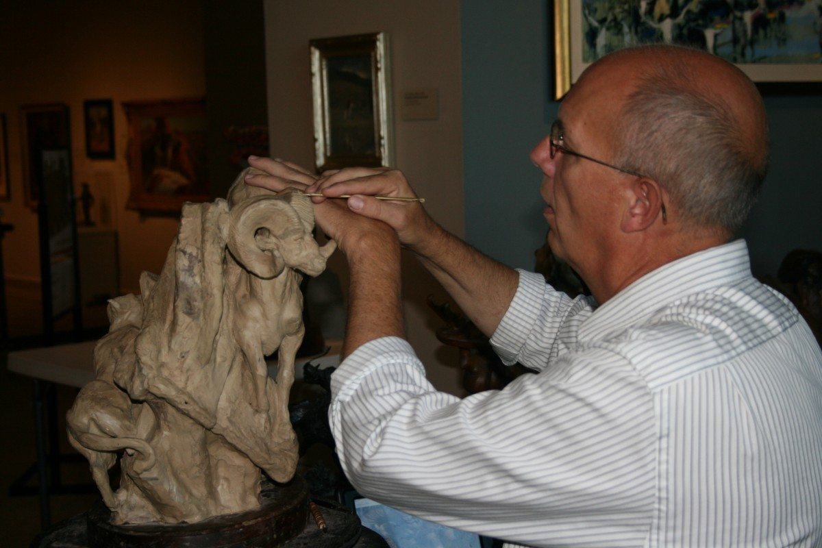 Jeff Rudolph sculpting in clay.