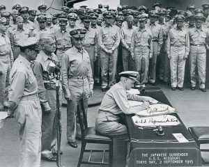Famous photograph of Admiral Nimitz accepting Japan's surrender to end World War II; this image was autographed by the Admiral for Jack Richard.