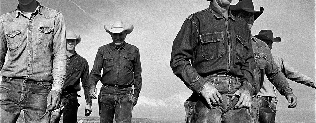 Laura Wilson. Cowboys Walking, J.R. Green Cattle Company Shackelford County, Texas, May 13, 1997. Gelatin silver print, 44 x 66 in. Private Collection.