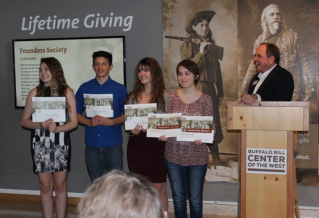 Winners of our Centennial History Contest receive their awards from Center of the West Executive Director Bruce Eldredge.