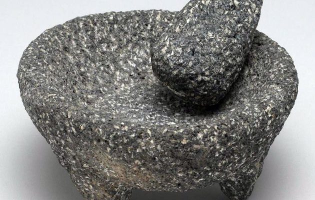 Mortar and pestle, both carved from porous rock from the Center’s collection, NA.106.437