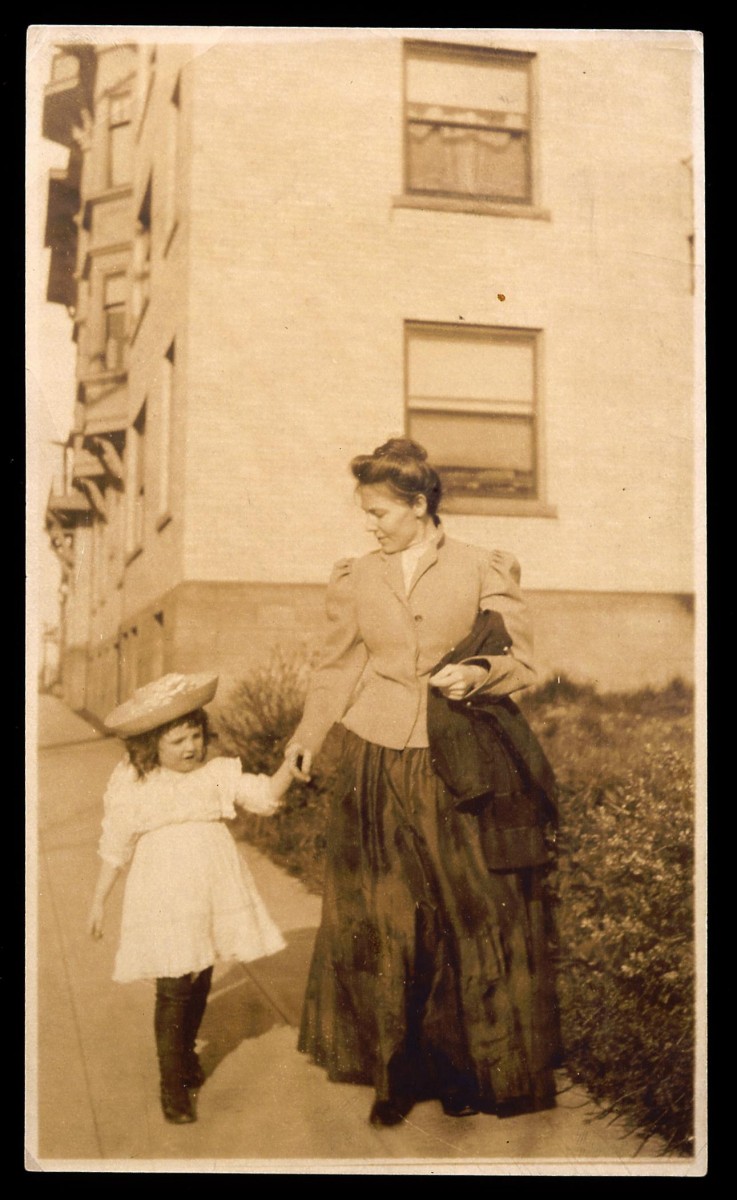 The first and second curators of the Buffalo Bill Museum, Mary Jester Allen leads her daughter Helen down a street in Seattle in 1909. MS 41 Mary Jester Allen, Original Buffalo Bill Collection, McCracken Research Library. P.41.1