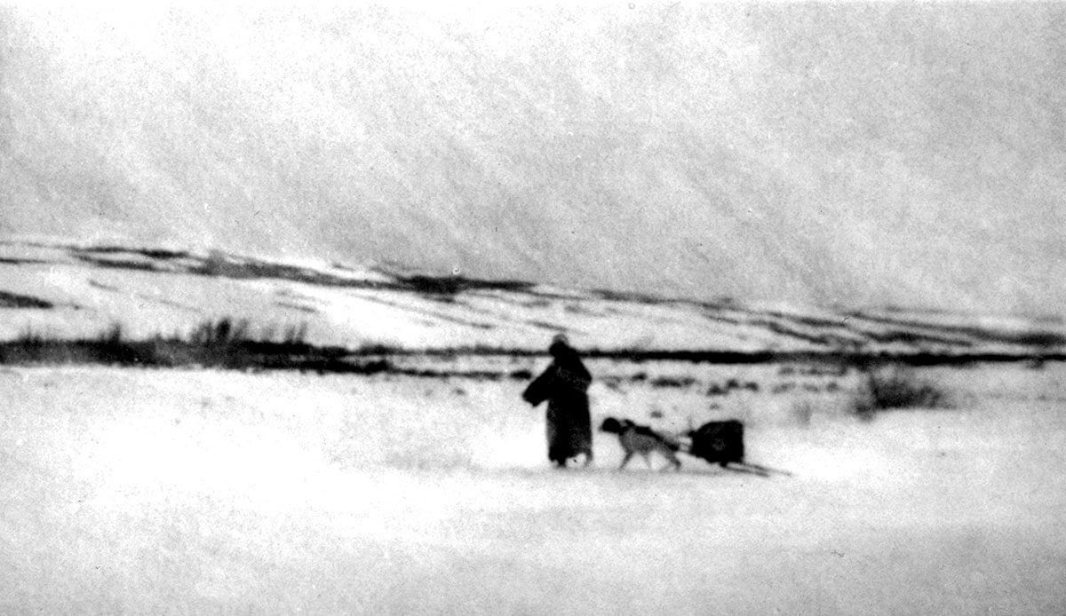 Native American with dog pulling travois, ca. 1880-1900. MS 35 North American Indian Photograph Collection. P.35.50