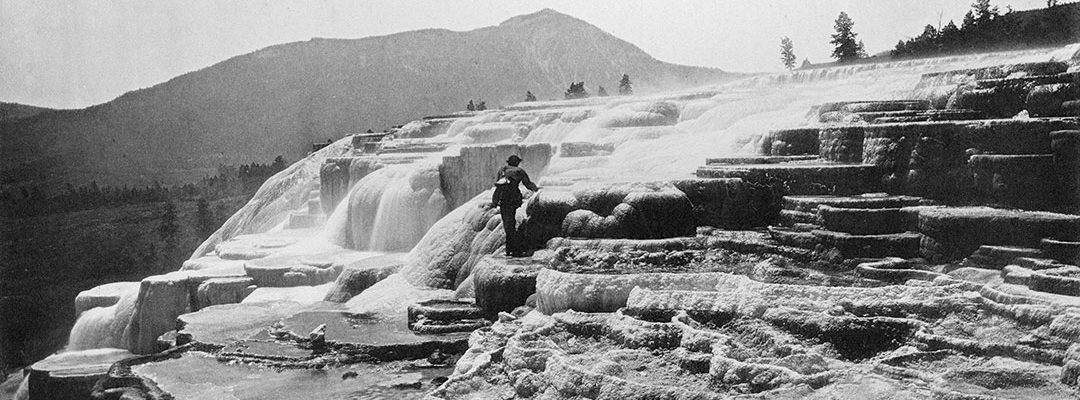 Hayden was certain that Jackson's photographs—like this one of artist Thomas Moran at White Mountain Hot Springs (today's Mammoth Hot Springs)—would sell Yellowstone. He simply needed an economical way to do it. WHJ-A.058