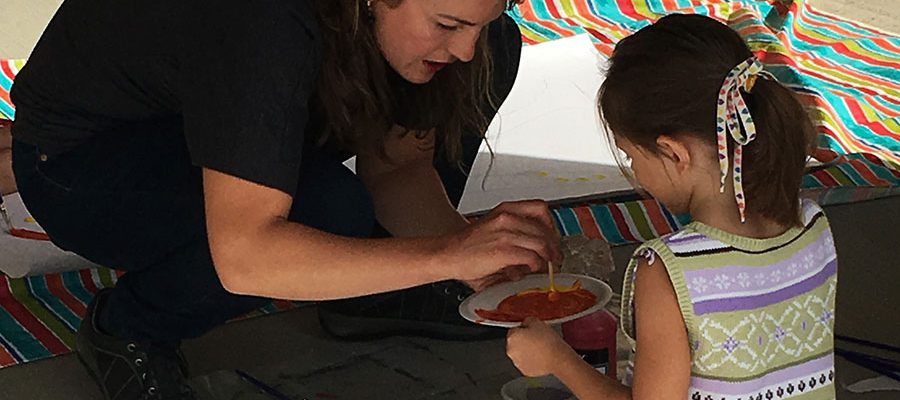 A "Little Aspiring Artist" gets some tips from instructor Sarah Shearer.