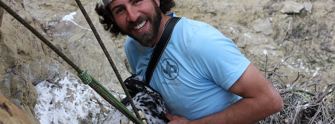 Team member and photographer Nick Ciaravella rappels down to an eagle nest. C.R. Preston photo.