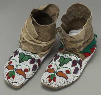 Crow Moccasins, ca. 1885. rawhide, felt, seeds, beads, cloth. NA.202.119