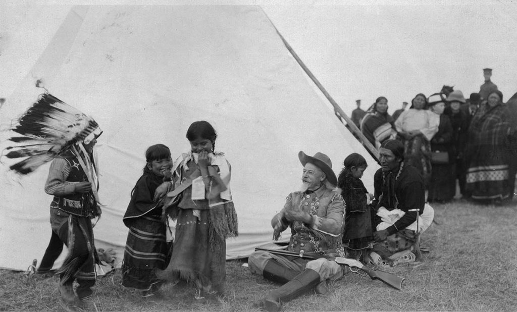 Buffalo Bill with Indian children at his Wild West, ca. 1915. MS6 William F. Cody Collection, McCracken Research Library. P.6.0243