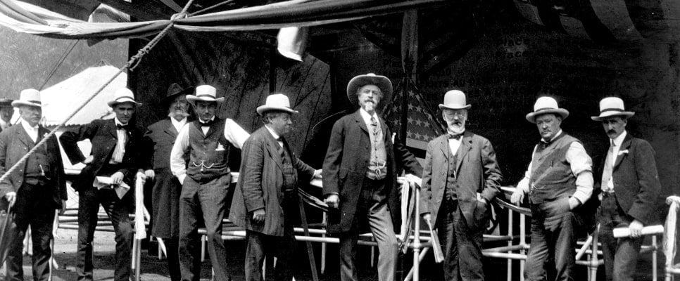 William F. Cody, James A. Bailey and other men at the entrance to the wild west show, ca. 1900. MS006 William F. Cody Collection. P.69.0986.