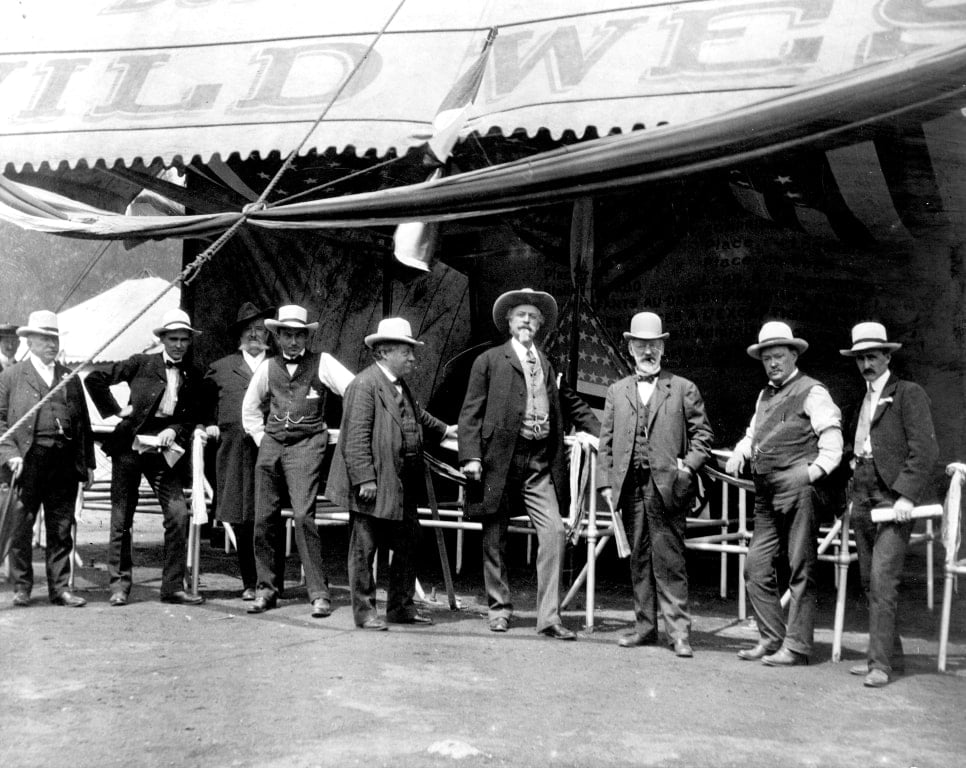 William F. Cody, James A. Bailey and other men at the entrance to the wild west show, ca. 1900. MS006 William F. Cody Collection. P.69.0986.