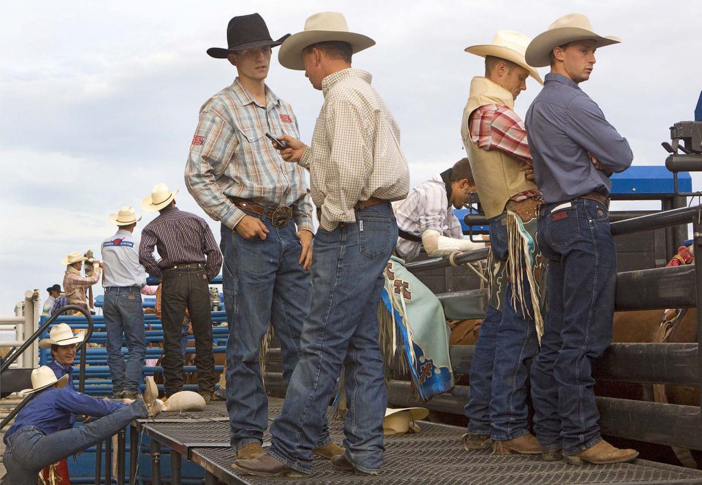 Cowboys waiting on the catwalk at Stampede Rodeo, July 2009. MS 426 Ken Blackbird Collection. P.426.05380