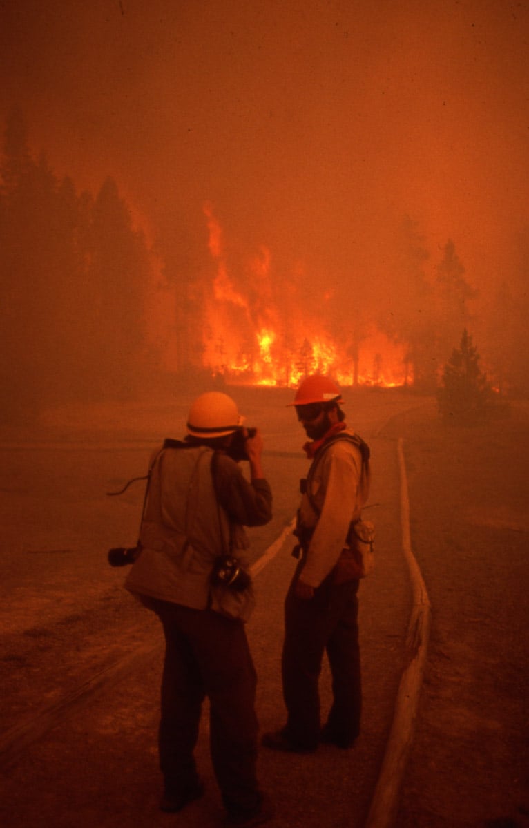 Larry Mayer, Billings [MT] Gazette, interviews park ranger Mike Bader at Norris Geyser Basin in Yellowstone on "Black Saturday." National Park Service photo by Jeff Henry, August 20, 1988.