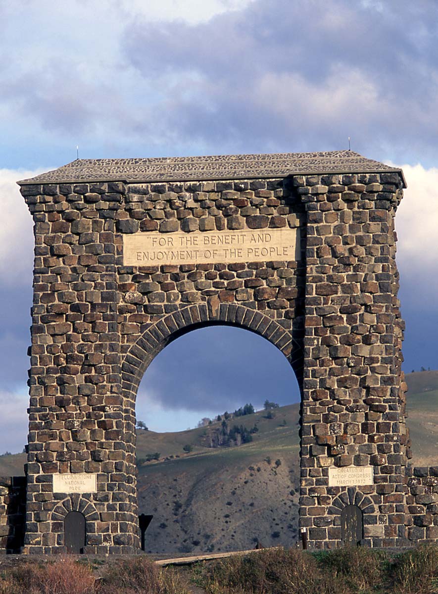 The Roosevelt Arch at Yellowstone's North Entrance affirms the Park's purpose, "For the benefit and enjoyment of the people." National Park Service photo by Jim Peaco, May 2003.