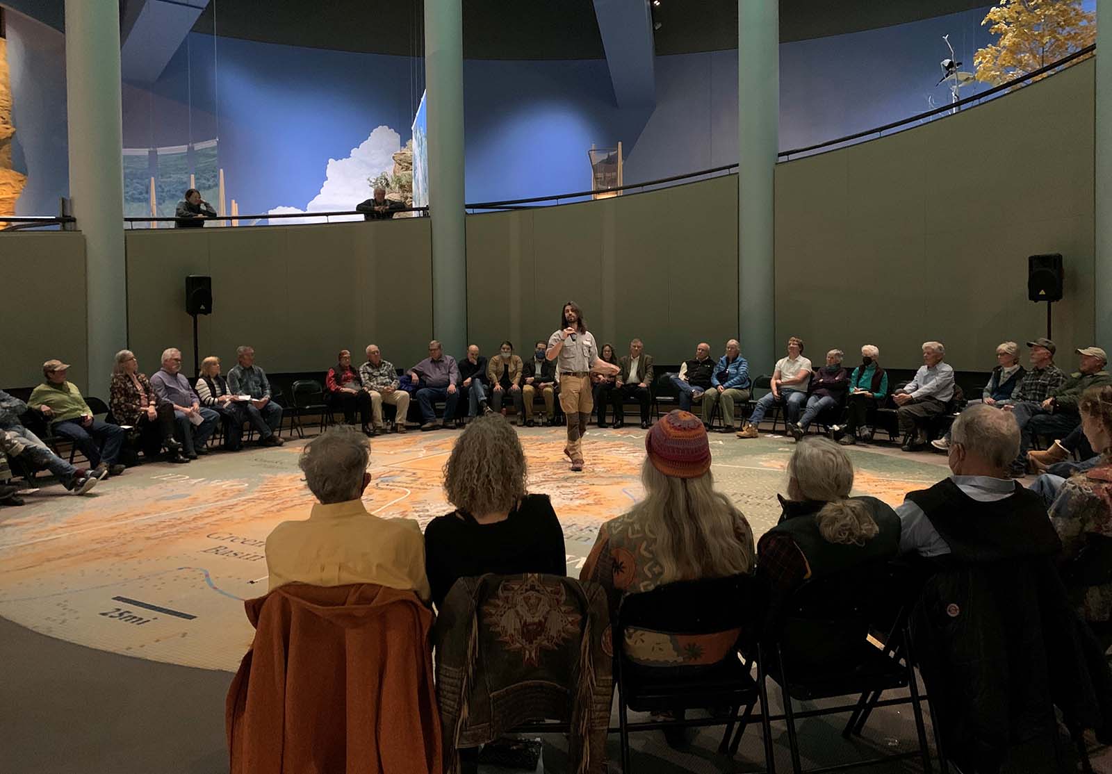 Draper Museum Interim Curator Corey Anco presents on the Tile Map in the Draper's rotunda.