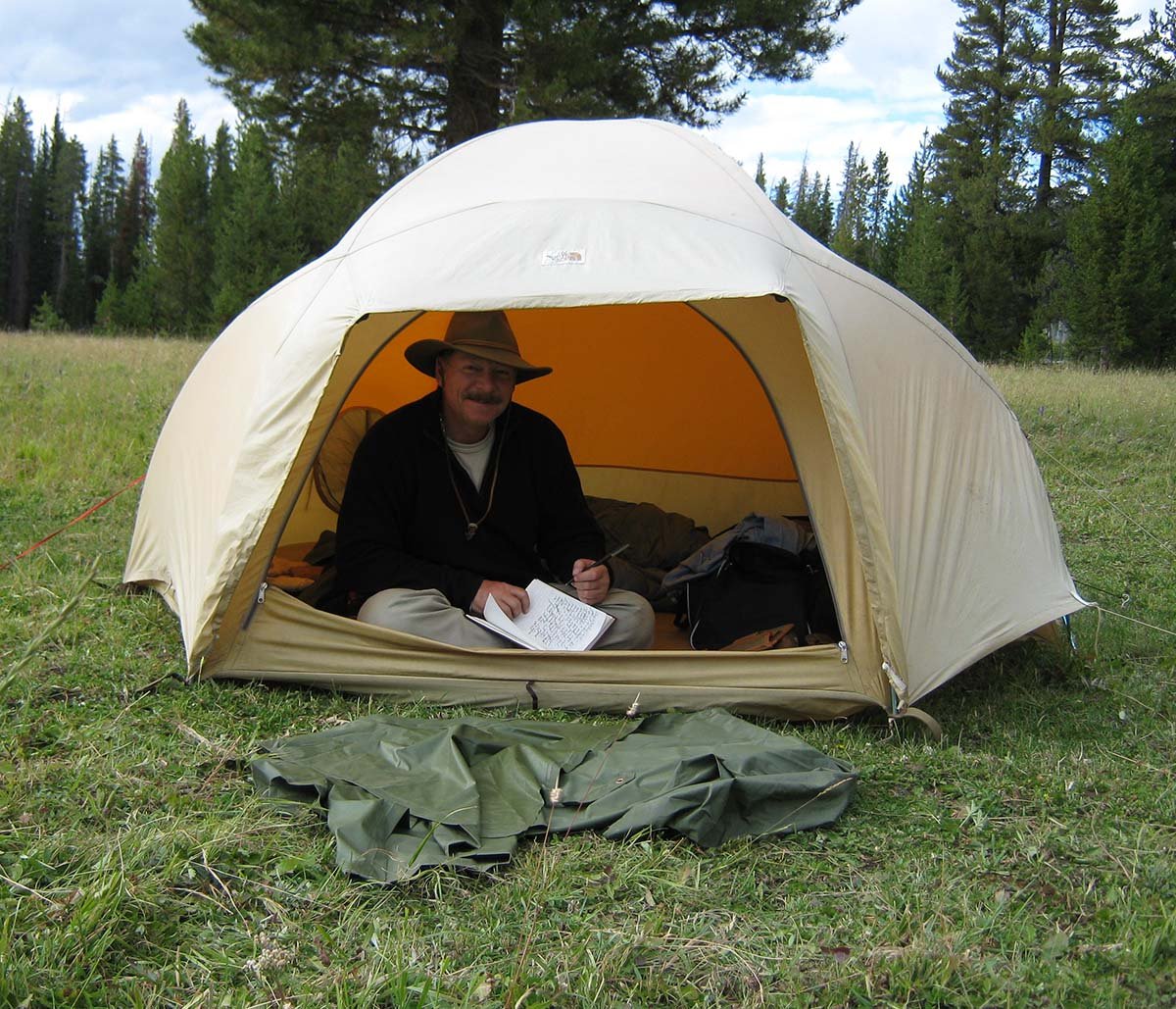 Chuck taking advantage of a quiet moment in camp to update his trip journal.