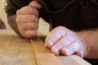 Leather craftsman Levi Nelson's hands