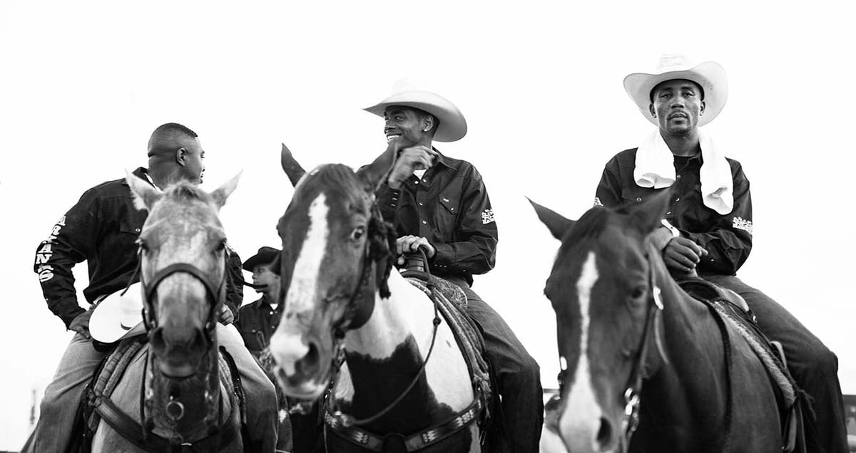 Photographer Ivan B. McClellan highlights the diversity of cowboys in America with his special exhibition "Eight Seconds: Black Cowboys in America." Three Kings: Joshua Williams, Julian Ward, Napoleon Brown, Okmulgee, OK. Photo by Ivan McClellan.