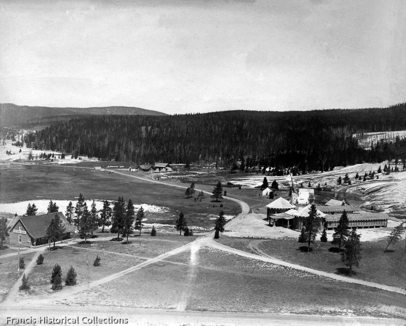 View from Old Faithful Inn of Upper Geyer Basin with buildings including Swimming Pool, Haynes Photo Shop and Ranger station, Yellowstone National Park