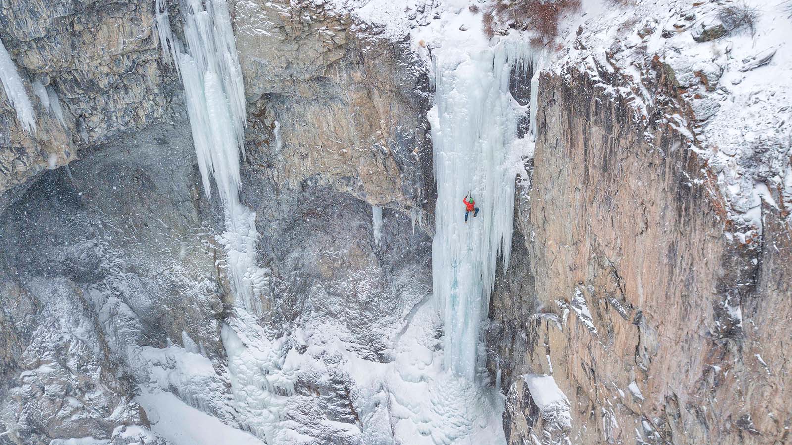 Cody-based ice climber Aaron Mulkey makes his way up a frozen waterfall called Bitches Brew, named after the song by Miles Davis. Doug Shepherd photo.