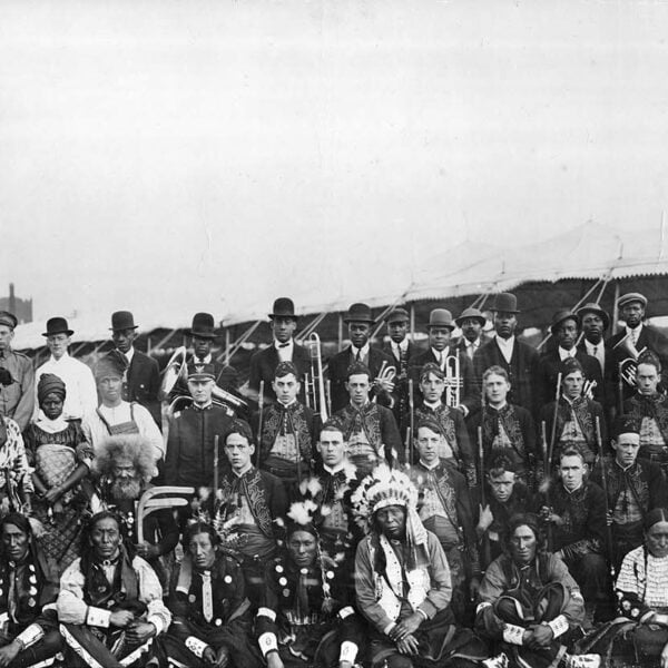 Large group of people, some with musical instruments.