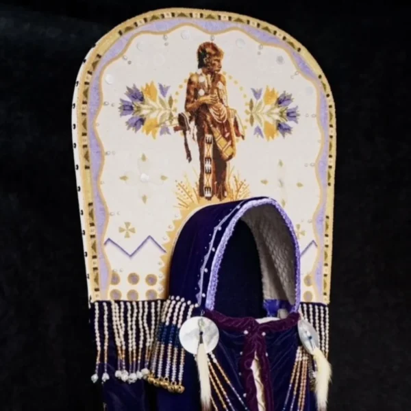 Plains Indian Cradleboard A Blackfeet story of the prairie crocus cradleboard by artist Jackie Larson Bread (Blackfeet). The cradleboard features tanned hide, velveteen, glass beads, shell, ermine and copper bells.